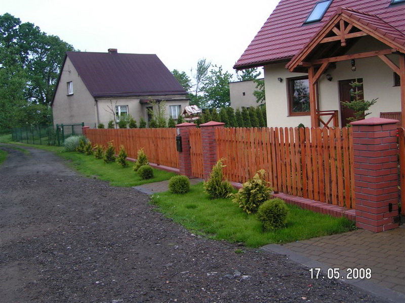 Wooden fence on grassy land
